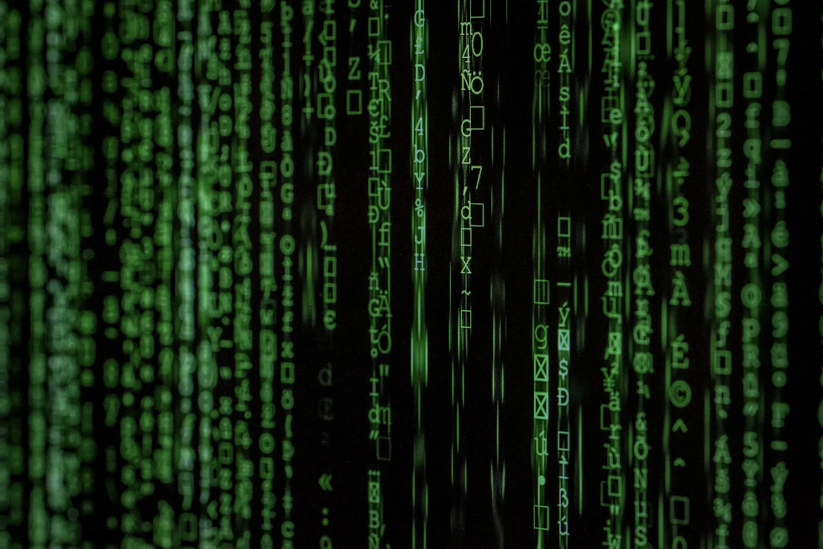 Abstract digital data streams and fiber optic network infrastructure glowing in dark server environment